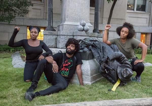 Activists in Durham with the toppled Confederate soldier statue. Rodney Dunning/Flickr/CC BY-NC-ND 2.0. Image cropped.